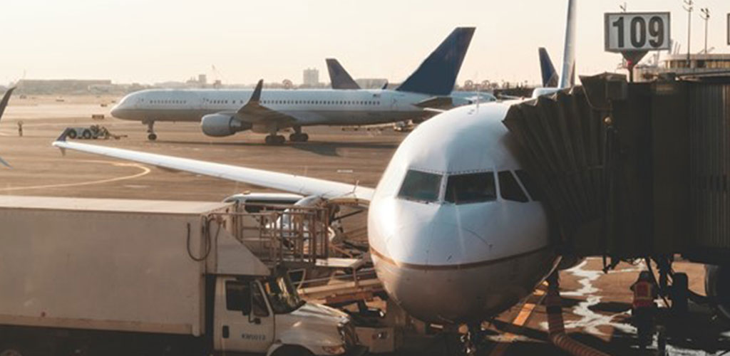 Aircraft parked on the ground at a major airport